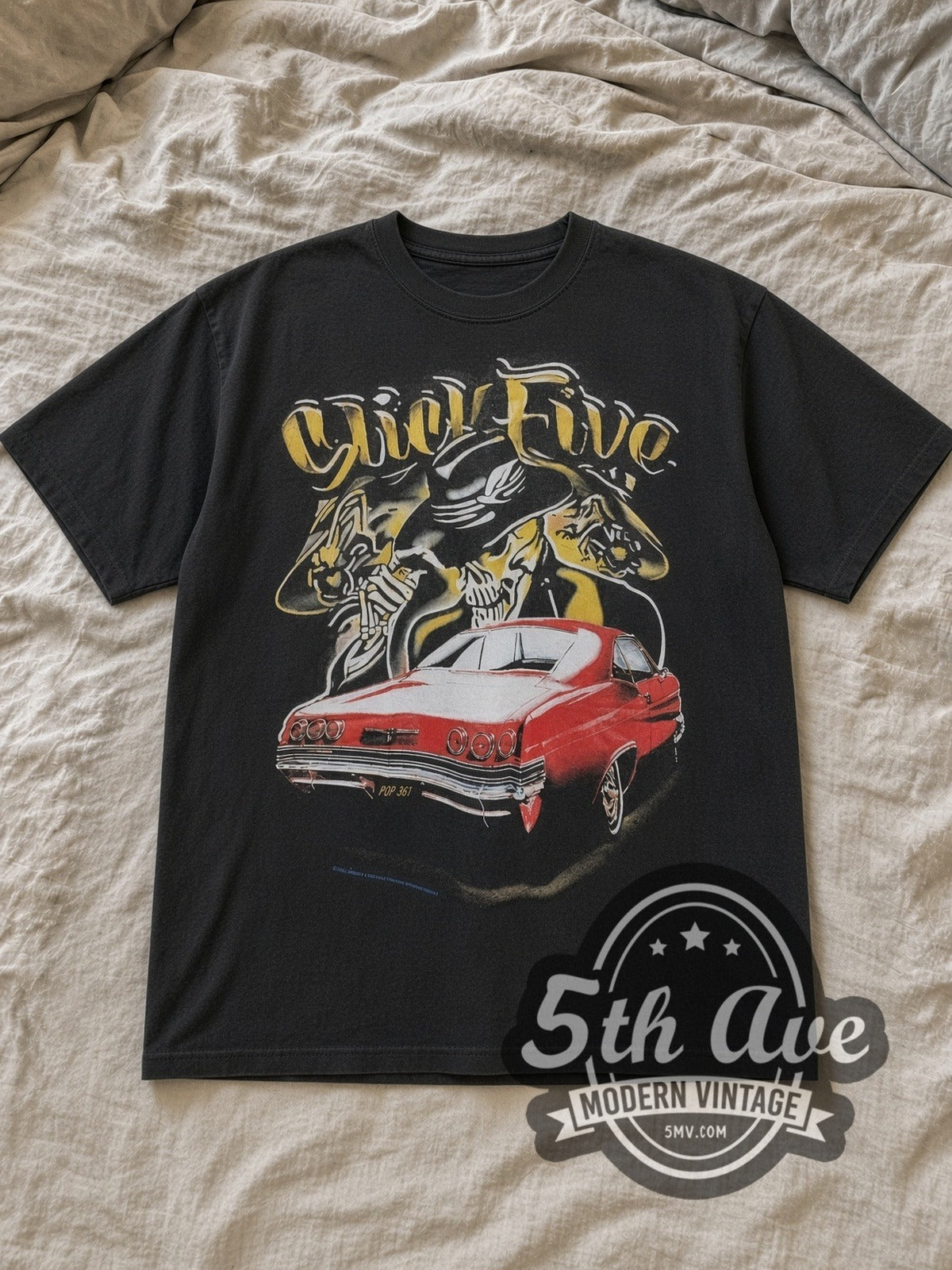 Black Rollin Hard Slick Five Lowrider Vintage Graphic T-Shirt laid flat on a linen bed