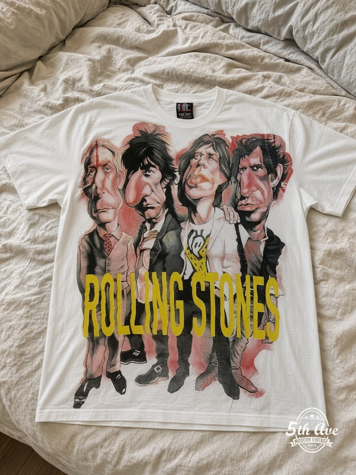 The Rolling Stones Voodoo Lounge Caricature all over print vintage tee laid on bed