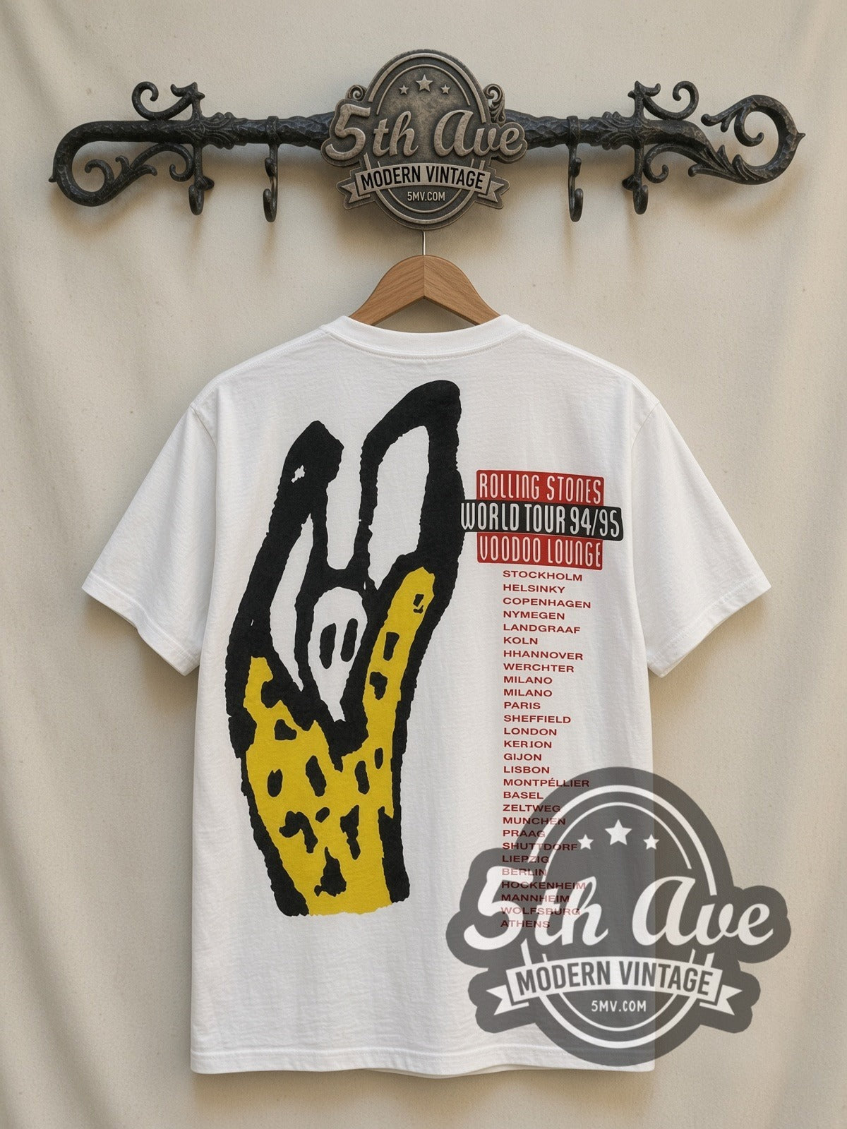 The Rolling Stones Voodoo Lounge Caricature all-over-print vintage band t-shirt in white, back view on a display rack