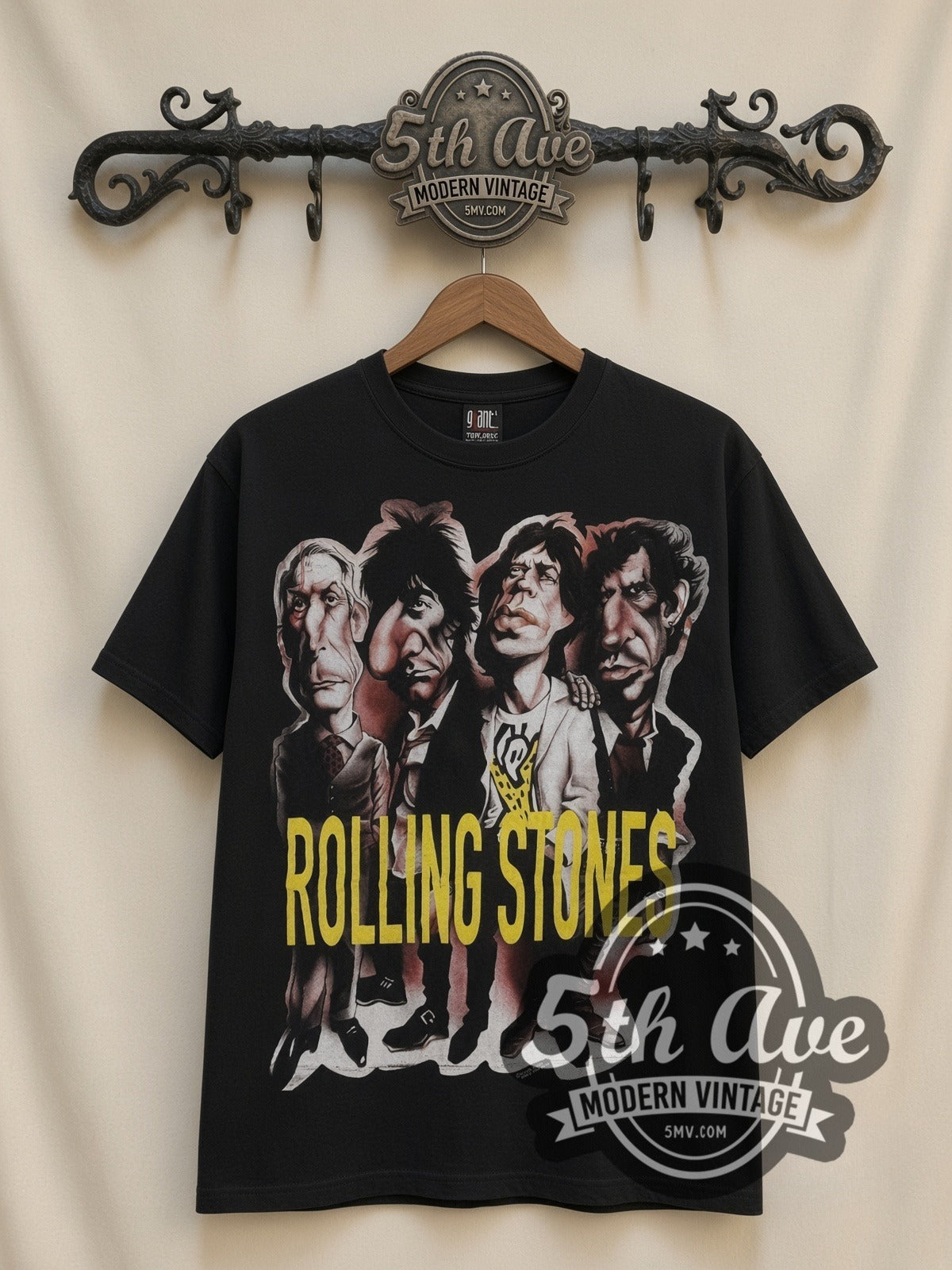 The Rolling Stones Voodoo Lounge Caricature all-over-print vintage band t-shirt in black, front view on a display rack