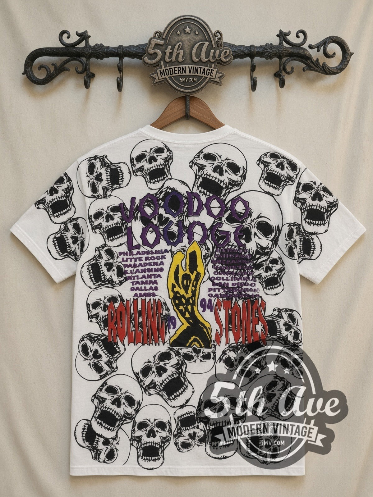 The Rolling Stones Voodoo Lounge Skulls all-over-print vintage band t-shirt in white, back view on a display rack