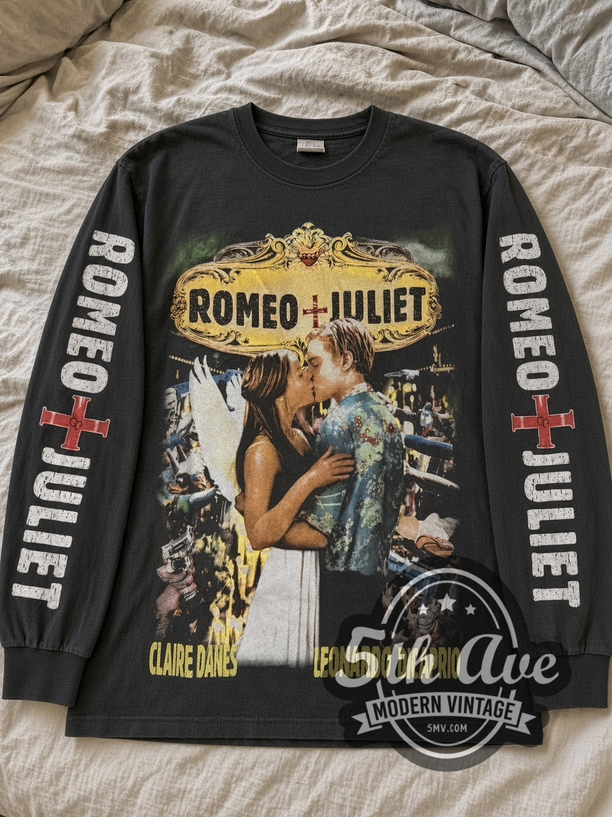 Faded black Romeo + Juliet DiCaprio & Danes Kiss Collage long sleeve tee laid flat on linen bed