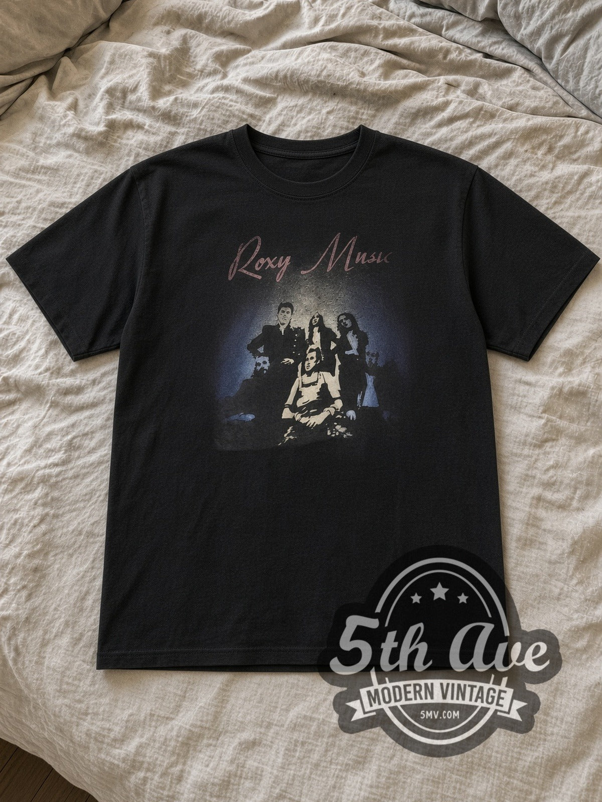 Black Roxy Music Vintage Band T-Shirt laid flat on a linen bed