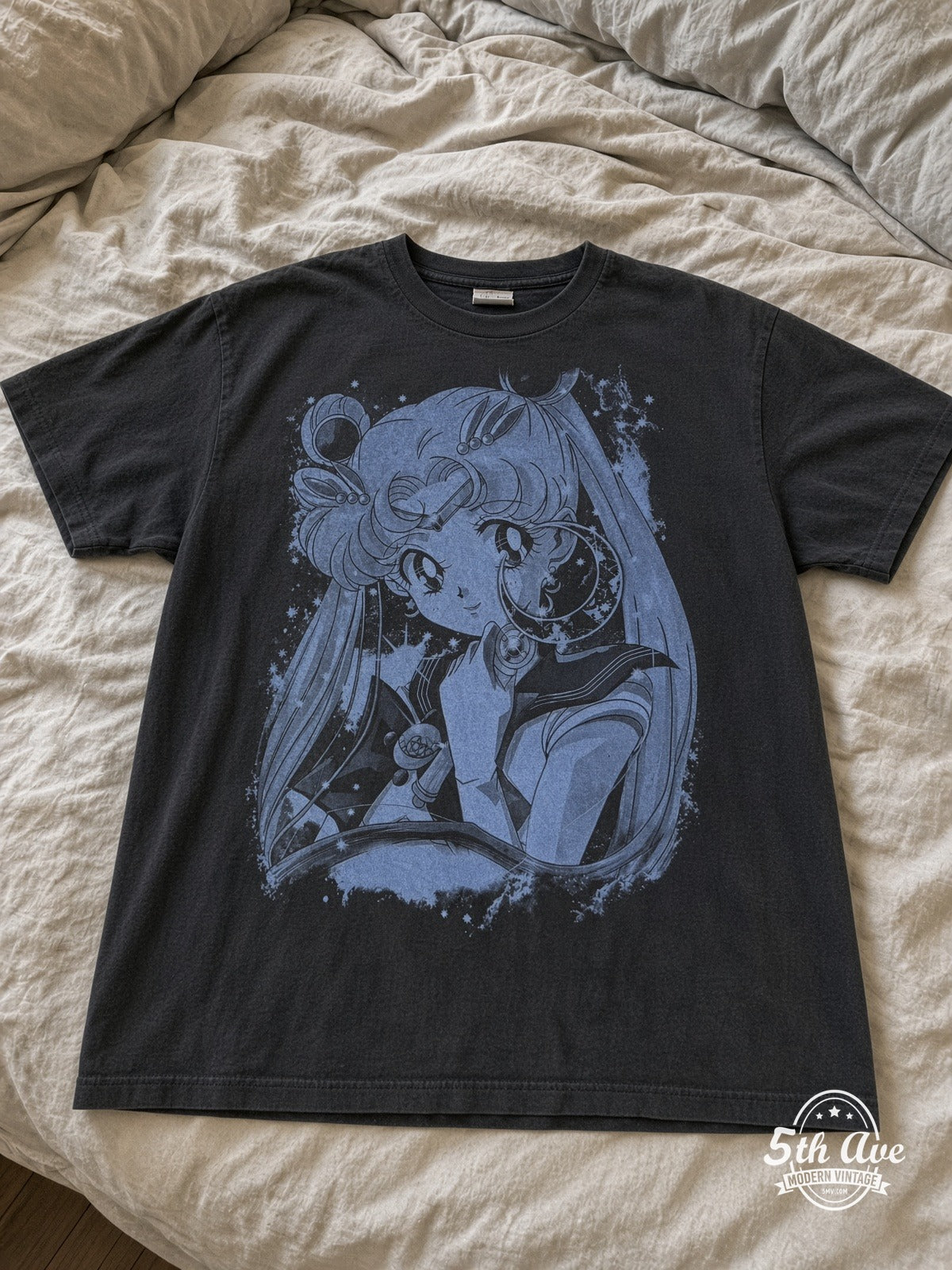 Sailor Moon Wand Portrait Blue Mono vintage tee laid on bed