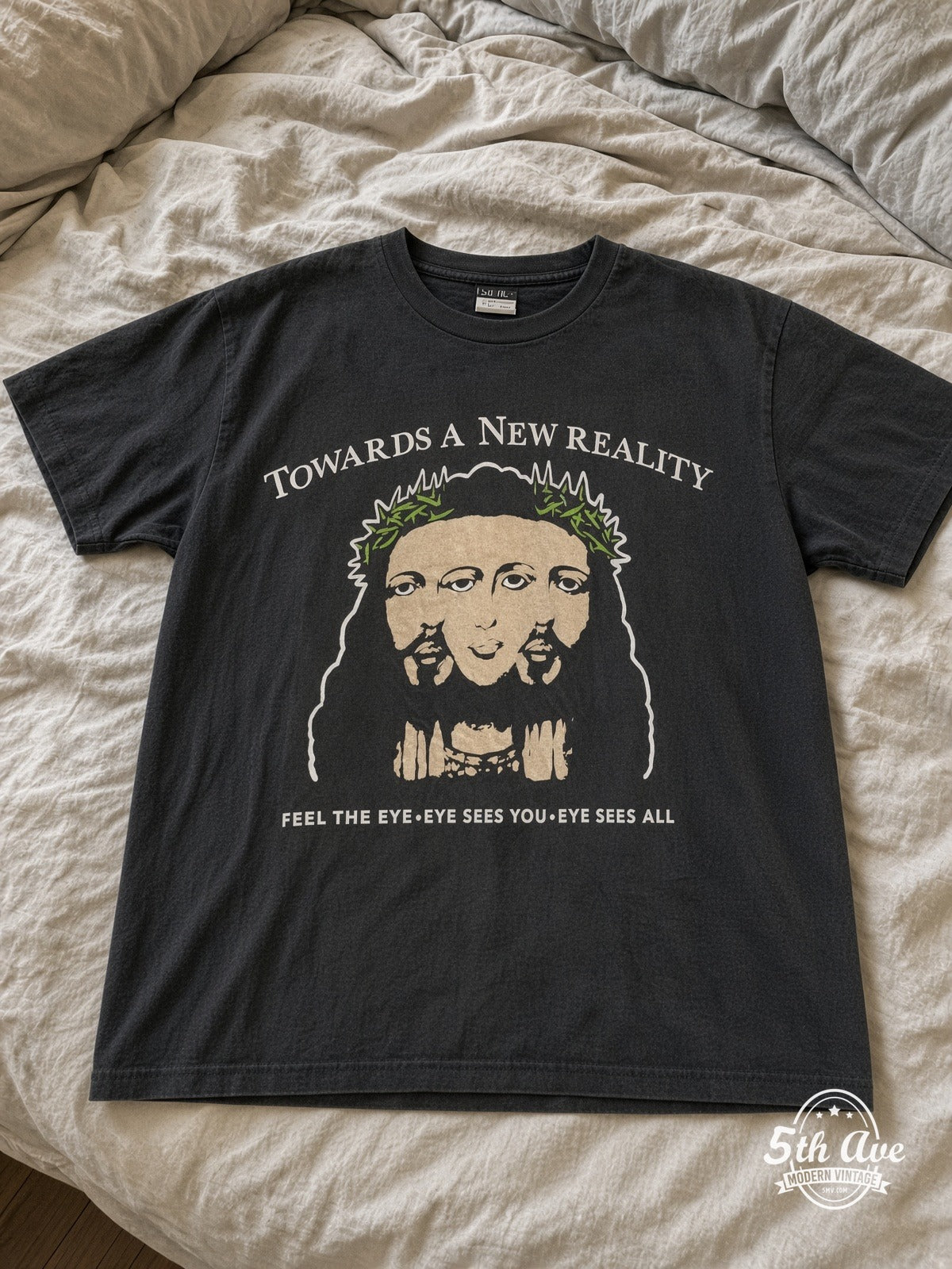 SAINT Towards A New Reality Visions vintage tee laid on bed