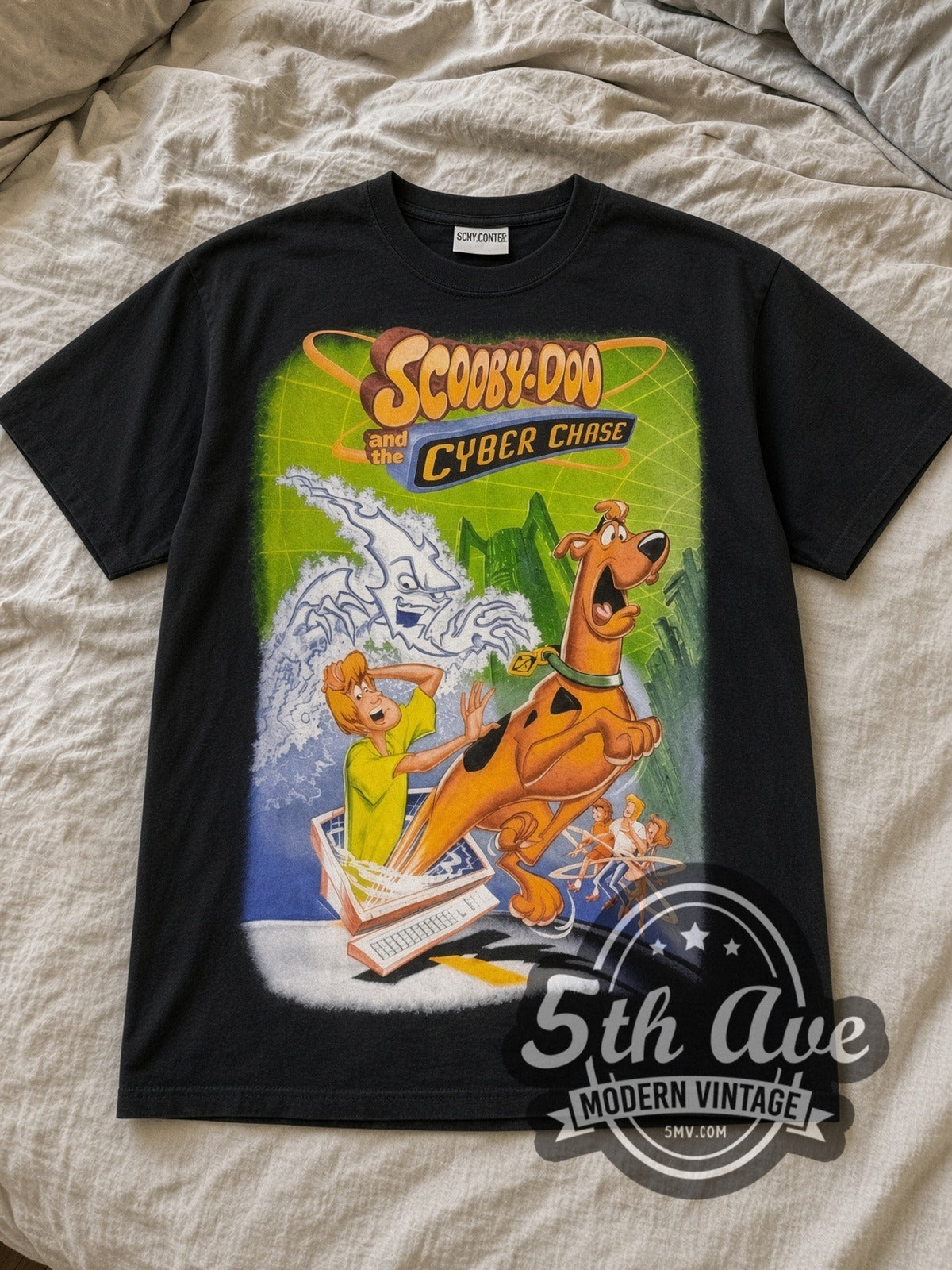 Black Scooby Doo Cyber Chase All Over Print Vintage Cartoon T-Shirt laid flat on a linen bed