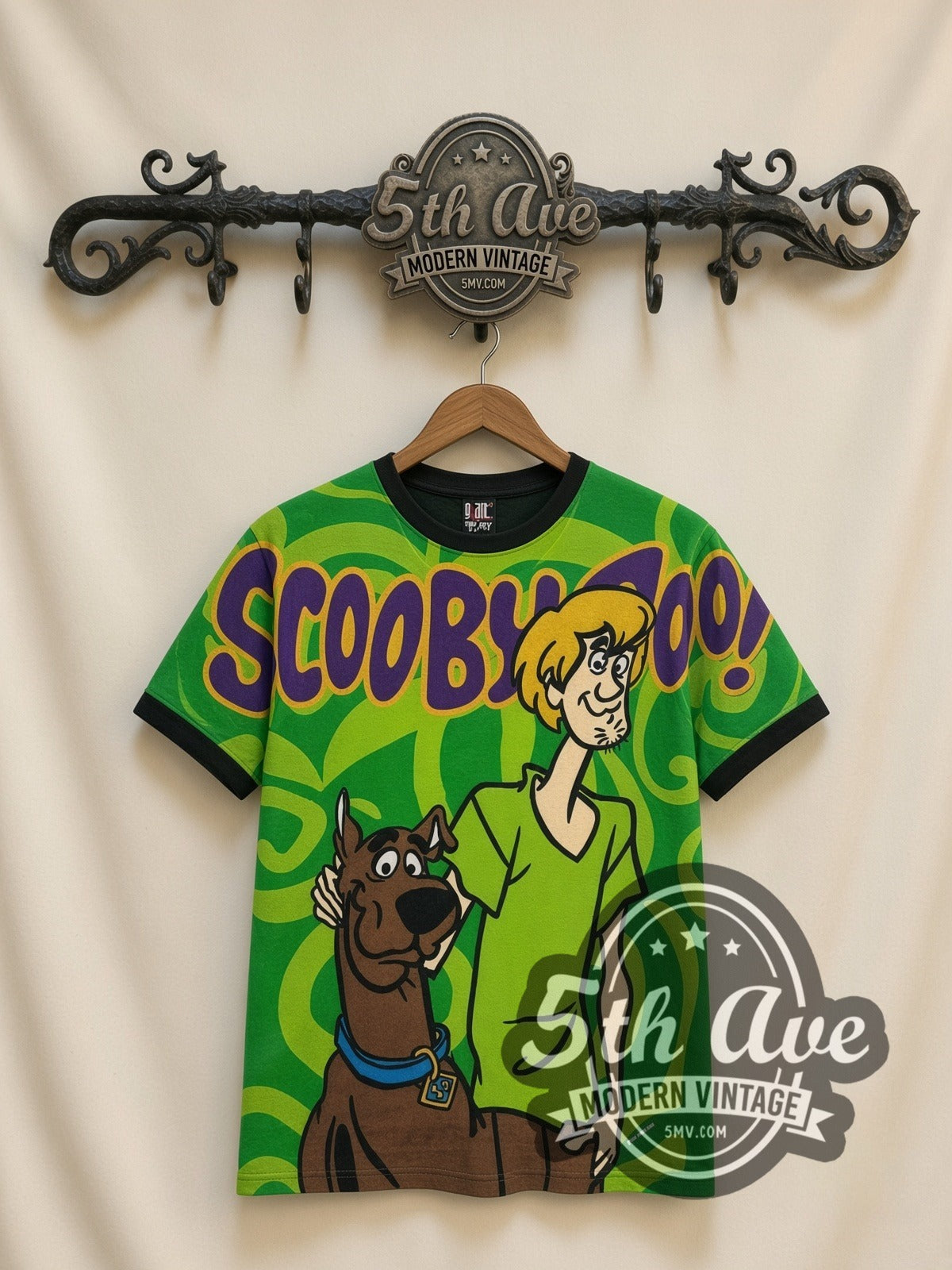 Scooby-Doo Scooby & Shaggy Green Swirl all-over-print vintage cartoon t-shirt in green, front view on a display rack