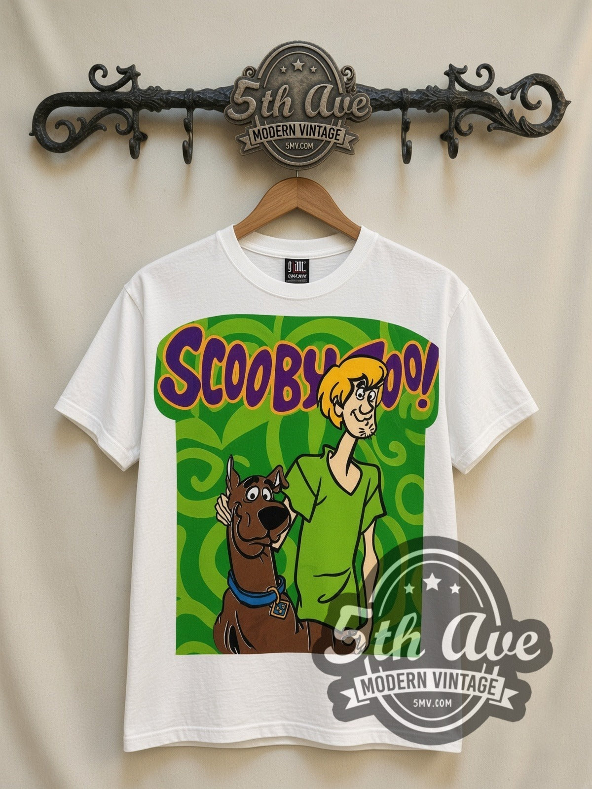 Scooby-Doo Scooby & Shaggy Green Swirl all-over-print vintage cartoon t-shirt in white, front view on a display rack