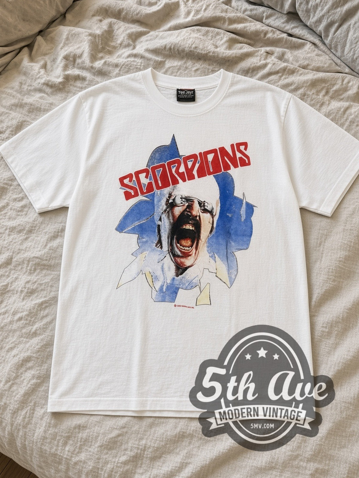 White Scorpions the Final Sting 1987 Vintage Band T-Shirt laid flat on a linen bed