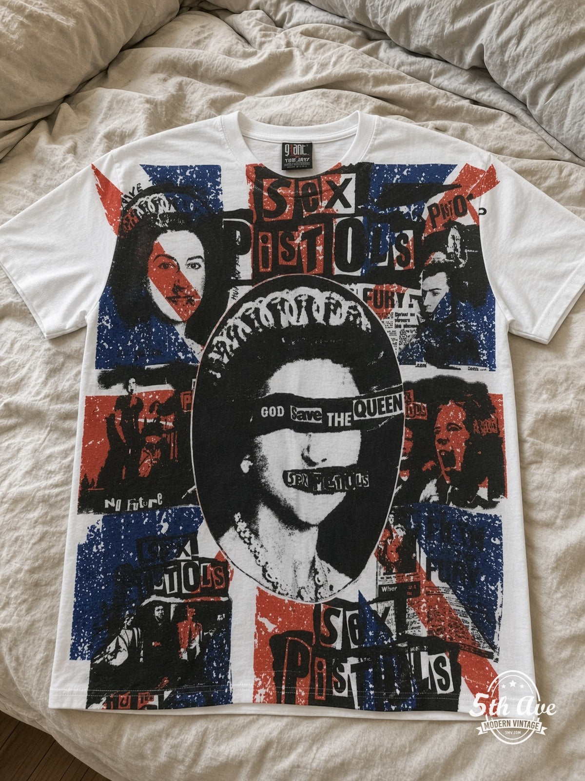 Sex Pistols God Save the Queen all over print vintage tee laid on bed