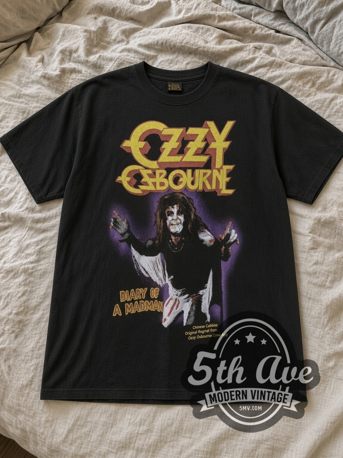 Black Ozzy Osbourne Diary of a Madman Vintage Band T-Shirt laid flat on a linen bed