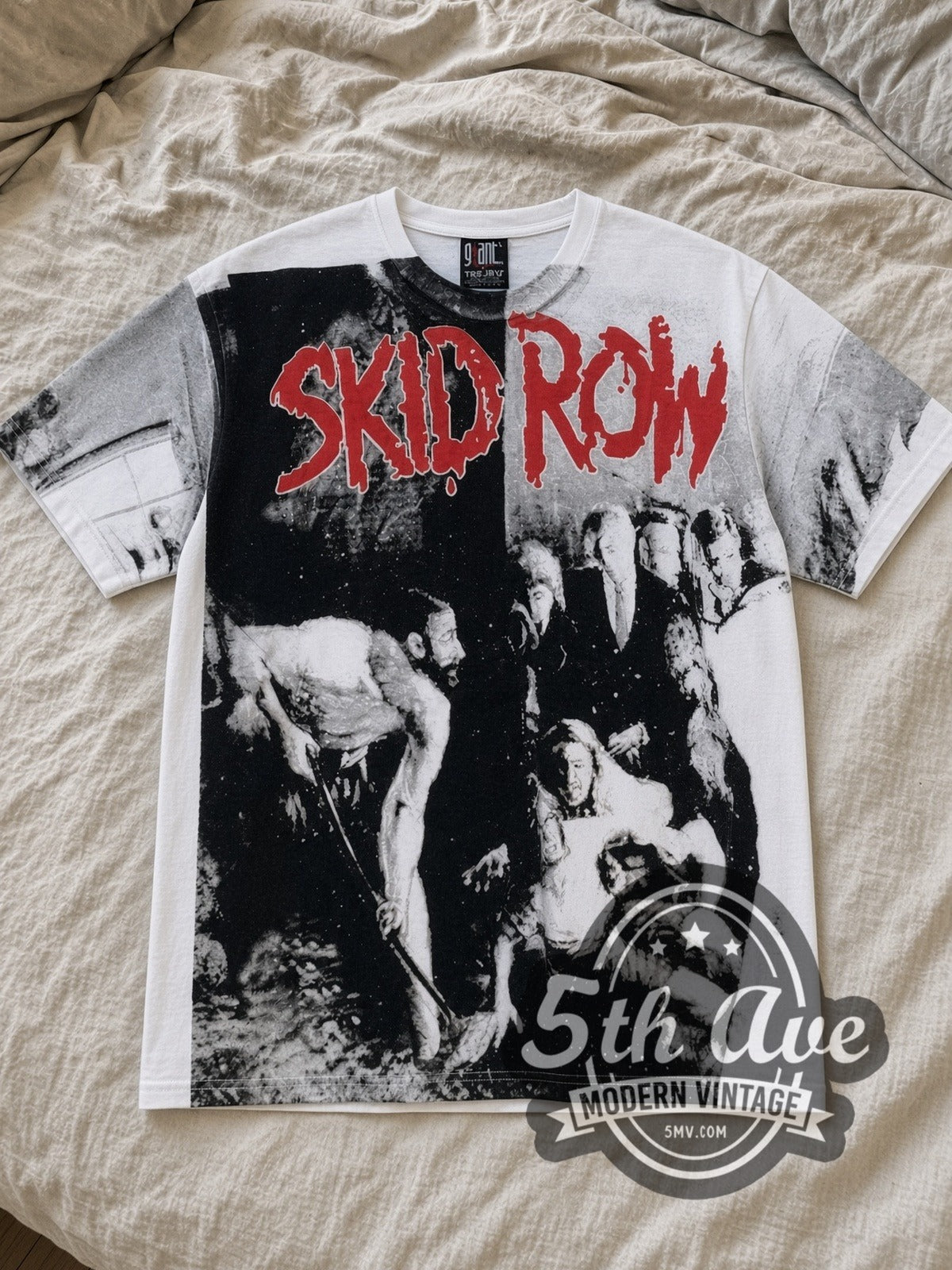White Skid Row Slave to the Grind All Over Print Vintage Band T-Shirt laid flat on a linen bed