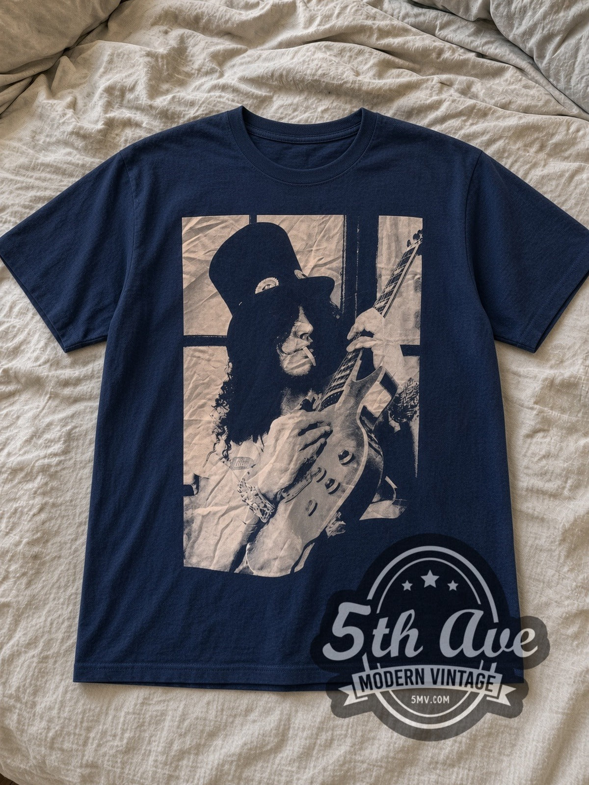 Navy Slash / Guns N' Roses Slash Guns N' Roses Vintage Band T-Shirt laid flat on a linen bed