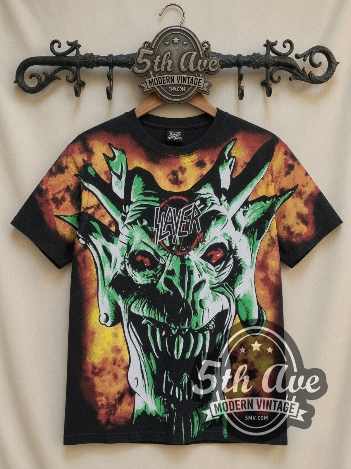 Slayer Demon Flames all-over-print vintage band t-shirt in black, front view on a display rack