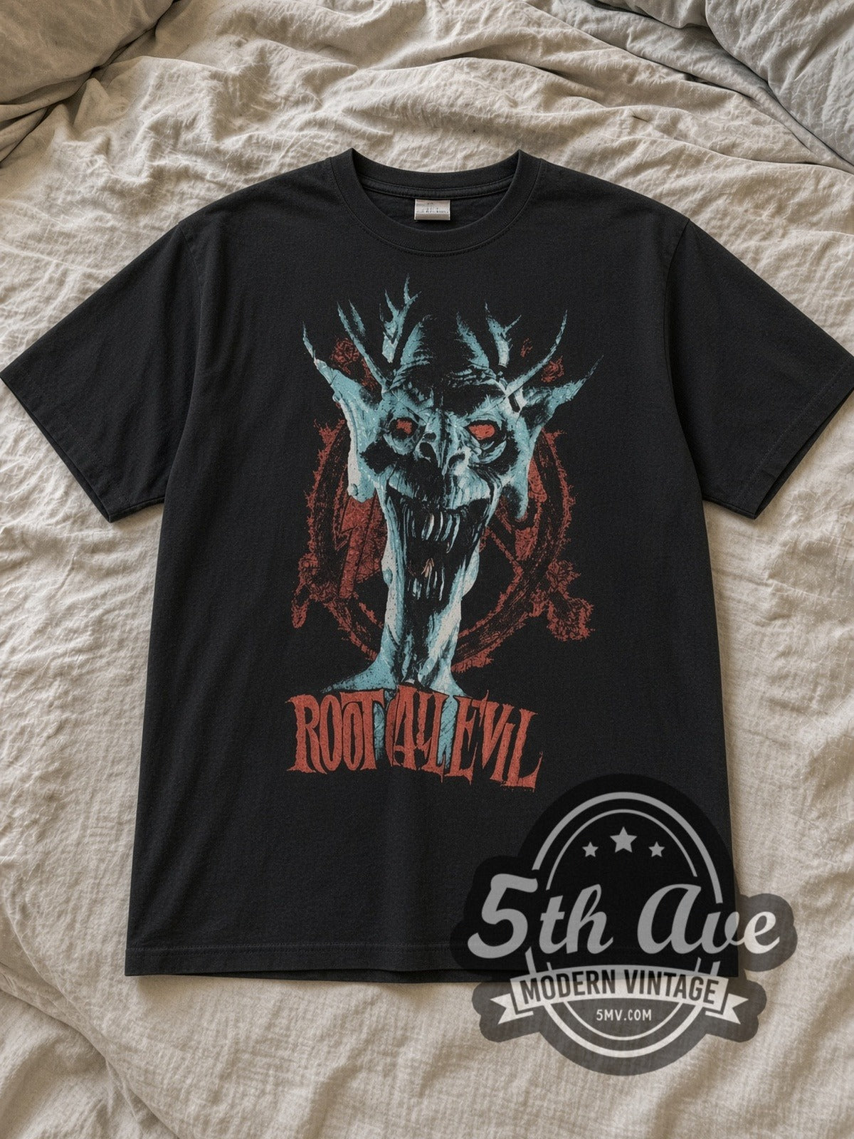 Black Slayer Root of All Evil Vintage Band T-Shirt laid flat on a linen bed