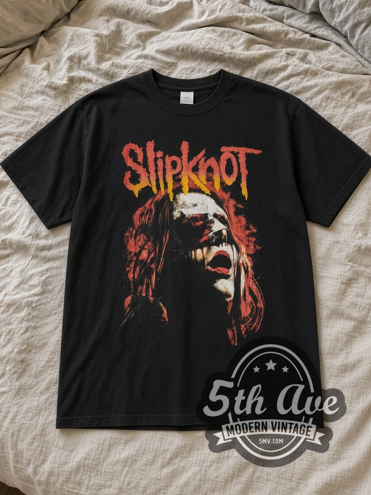 Black Slipknot Blindfold Vintage Band T-Shirt laid flat on a linen bed