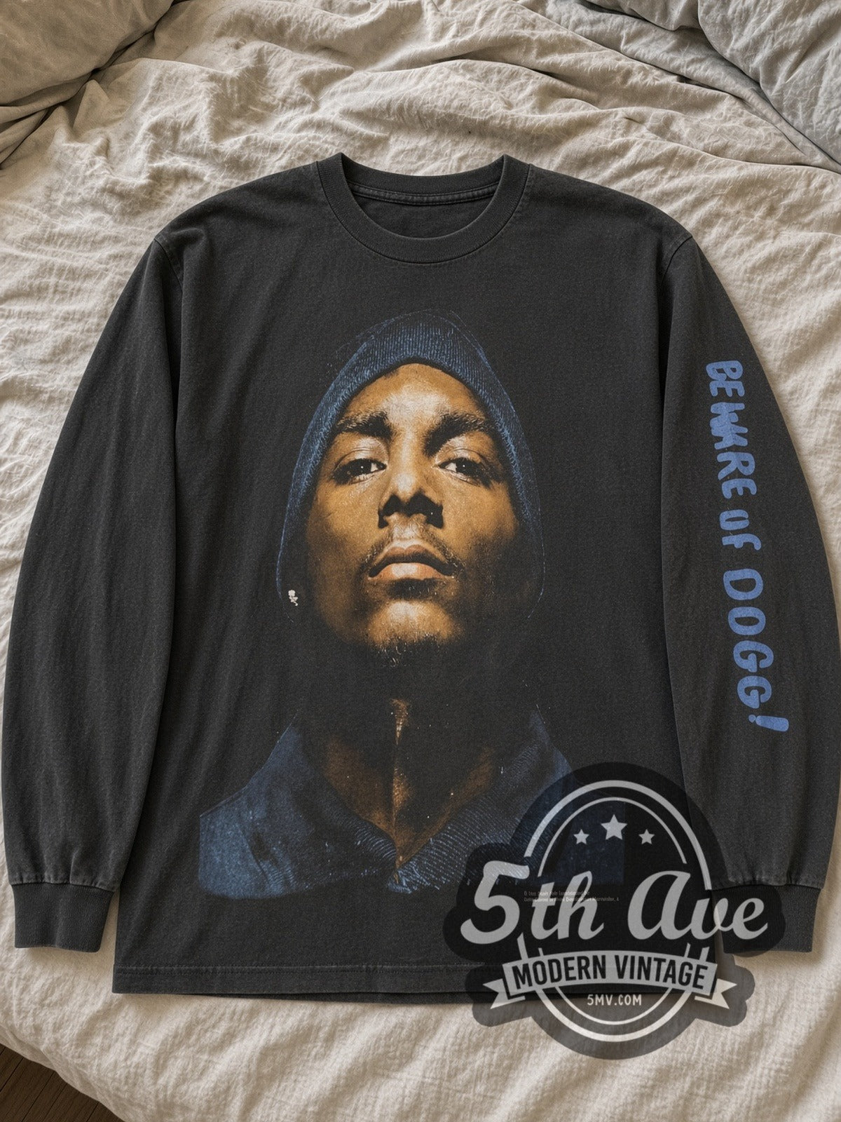 Black Snoop Dogg Beware of Dogg long sleeve laid flat on linen bed