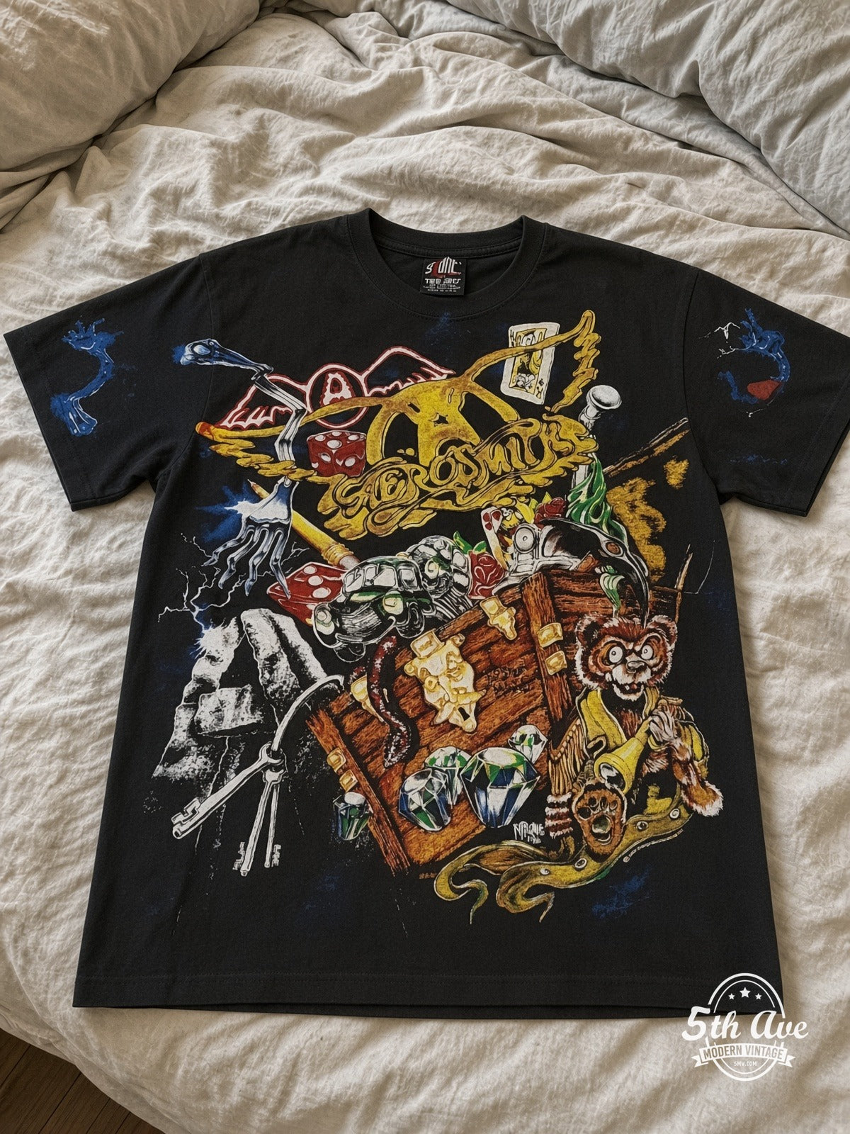 Social Distortion Skully Cards all over print vintage tee laid on bed
