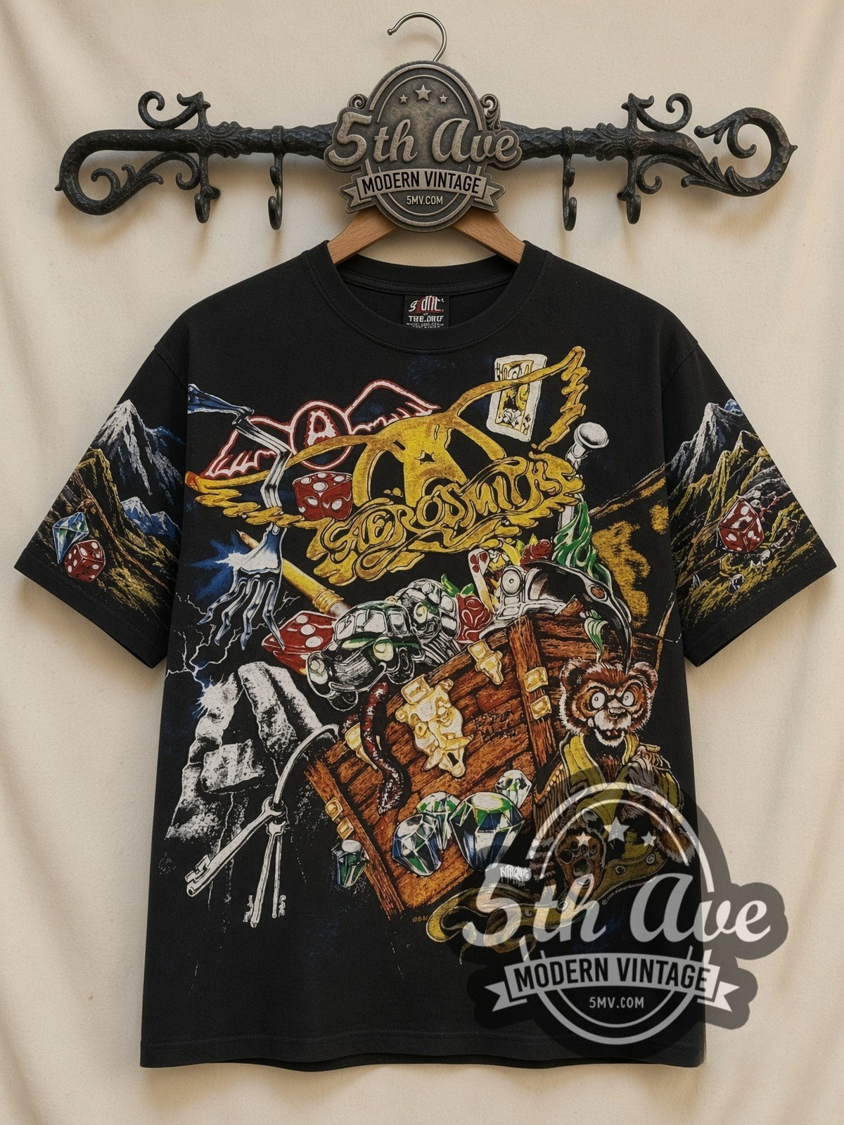 Aerosmith Treasure Chest all-over-print vintage band t-shirt in black, front view on a display rack