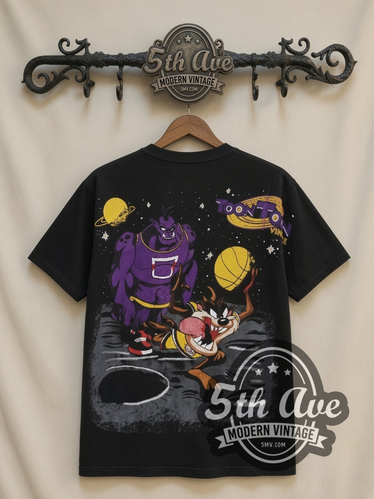 Space Jam Taz Center Court all-over-print vintage cartoon t-shirt in black, back view on a display rack
