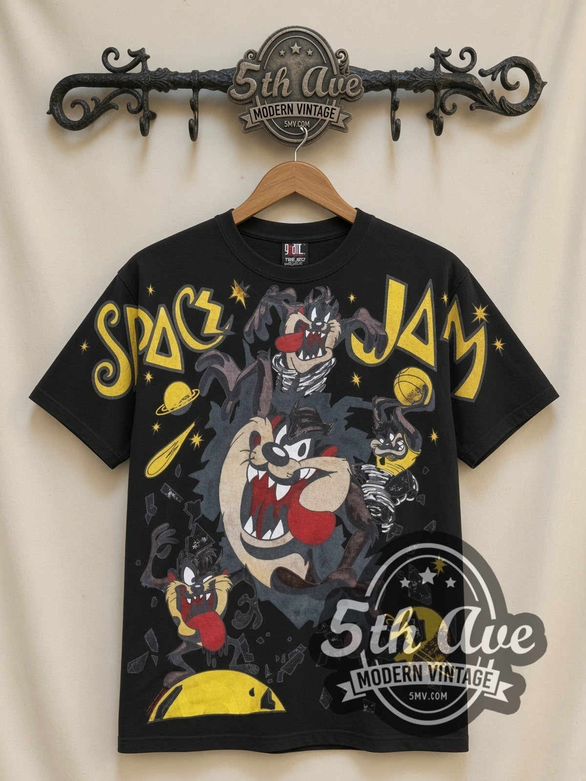 Space Jam Taz Center Court all-over-print vintage cartoon t-shirt in black, front view on a display rack