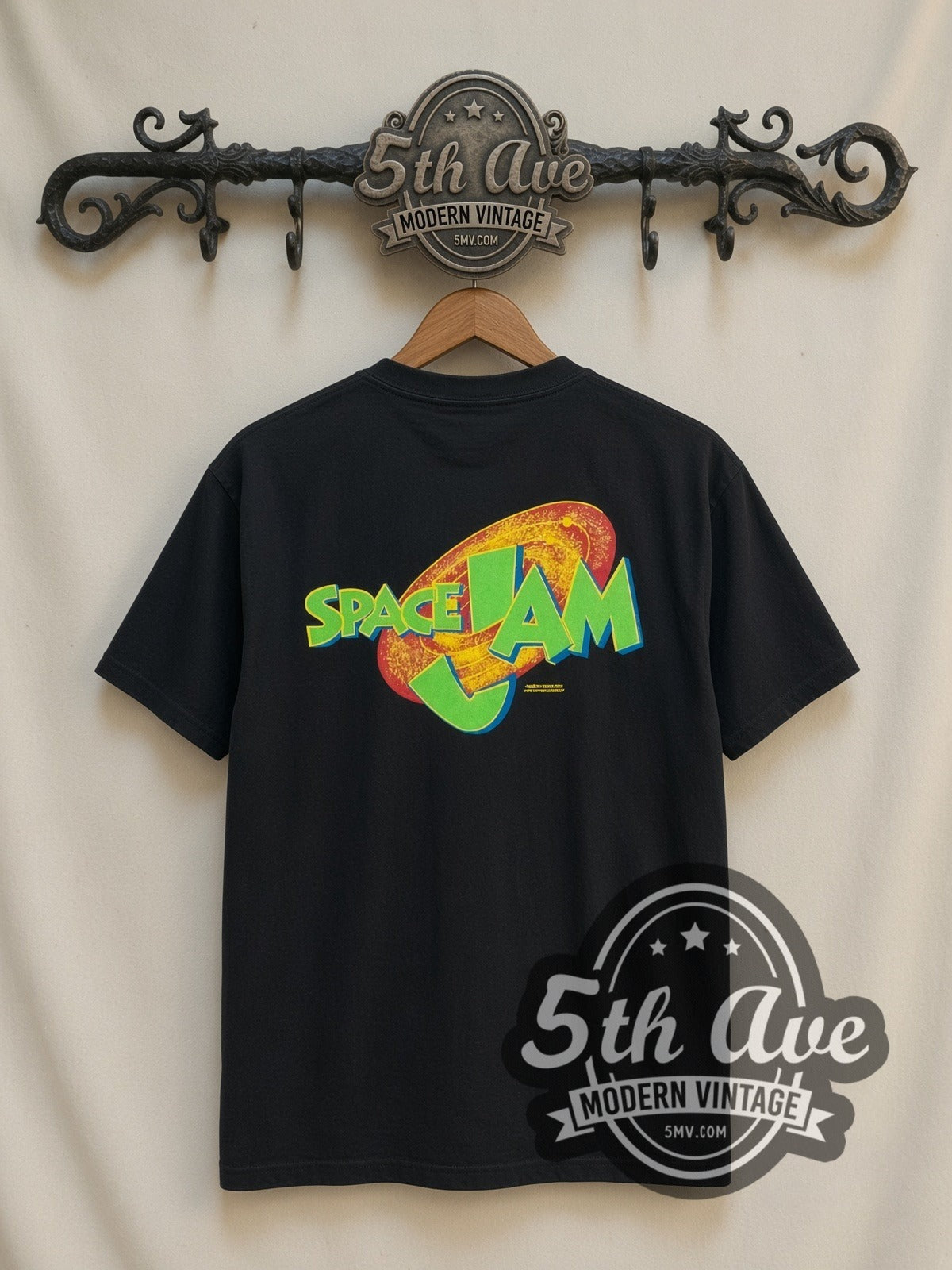 Space Jam Taz & Monstar all-over-print vintage cartoon t-shirt in black, back view on a display rack