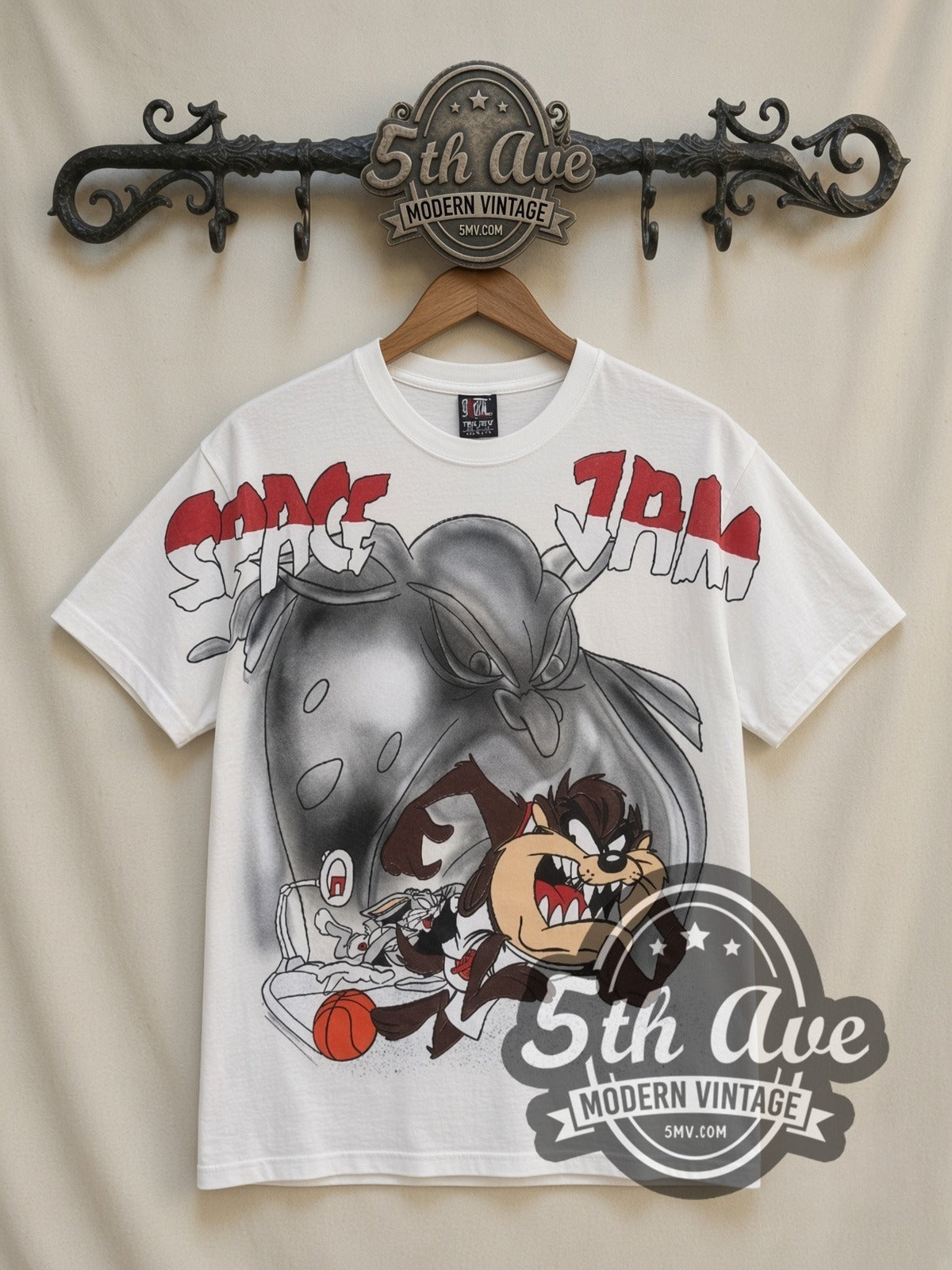 Space Jam Taz & Monstar all-over-print vintage cartoon t-shirt in white, front view on a display rack