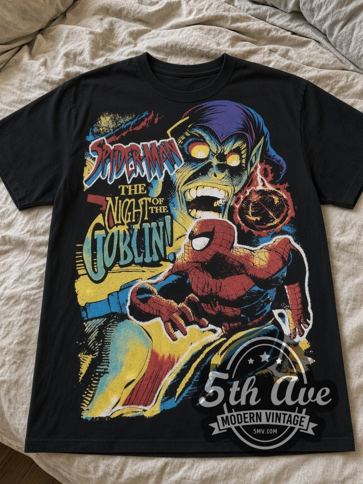 Spider-Man Night of the Goblin tee laid flat on a bed – front print