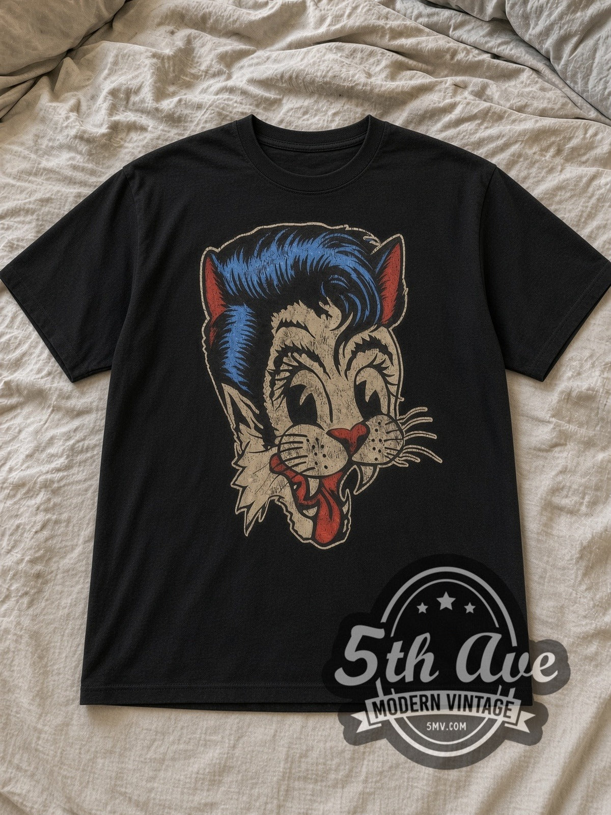 Black Stray Cats Blue Pompadour Cat Logo Vintage Band T-Shirt laid flat on a linen bed