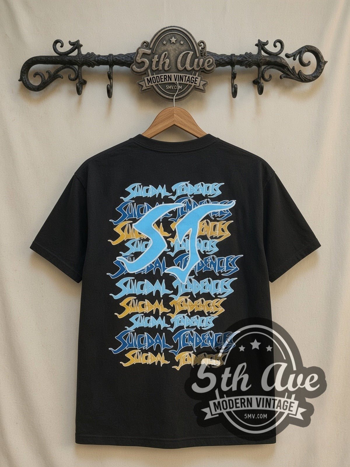 Suicidal Tendencies Logos Skeleton all-over-print vintage band t-shirt in black, back view on a display rack