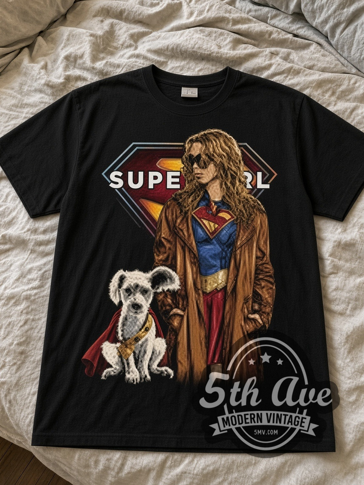 Supergirl Woman of Tomorrow Supergirl with Krypto black graphic tee laid flat on linen bed