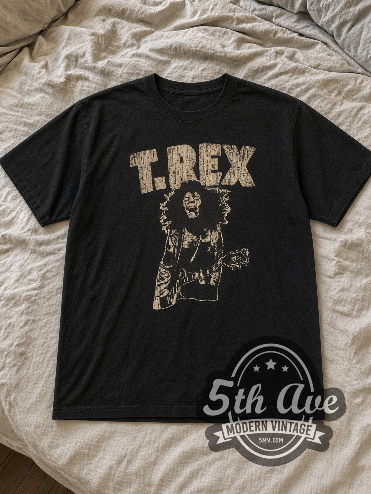 Black T. Rex Vintage Band T-Shirt laid flat on a linen bed