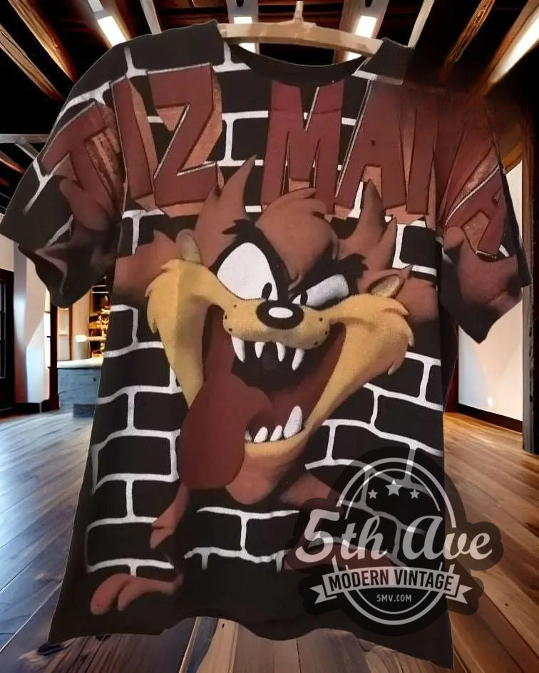 Taz-Mania All-Over Print Looney Tunes vintage cartoon t-shirt hanging on a hanger