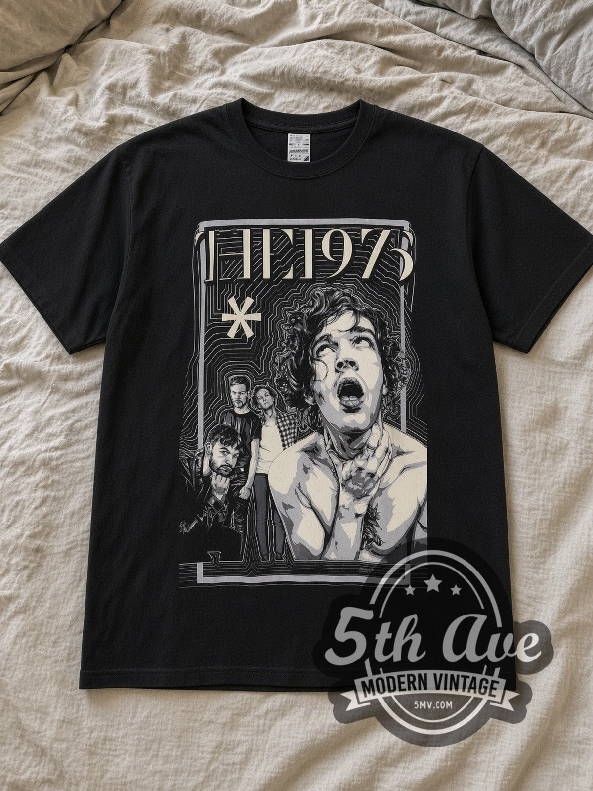 Black The 1975 Matty Healy Throat Clutch Asterisk Vintage Band T-Shirt laid flat on a linen bed
