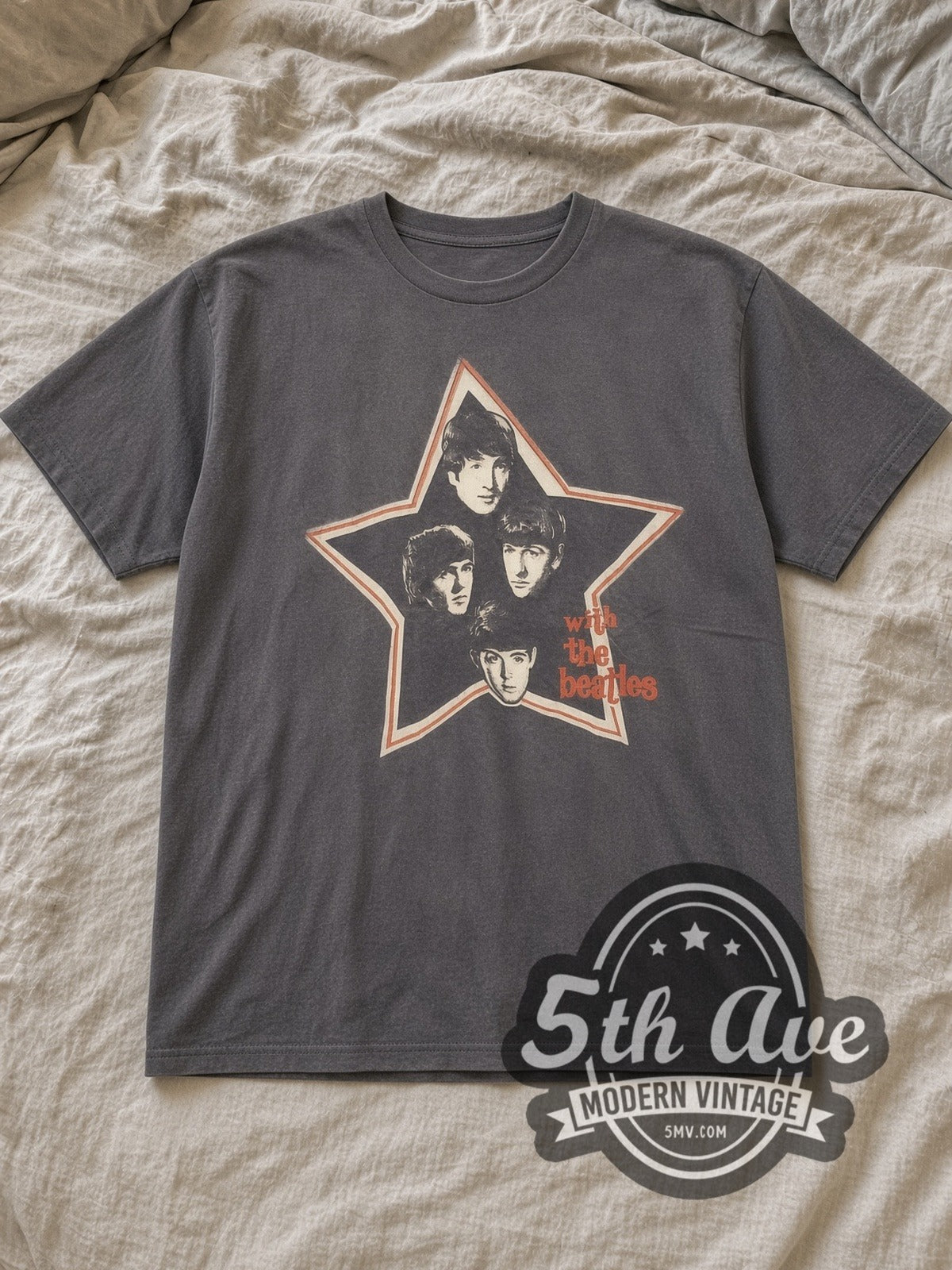 Charcoal The Beatles With The Beatles Star Portraits Vintage Band T-Shirt laid flat on a linen bed