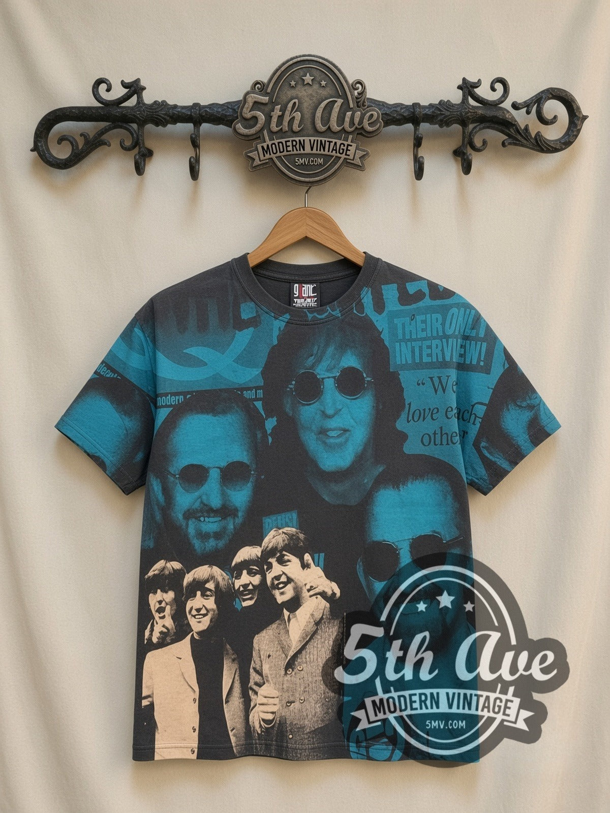 The Beatles Fab Four Collage all-over-print vintage band t-shirt, front view on a display rack