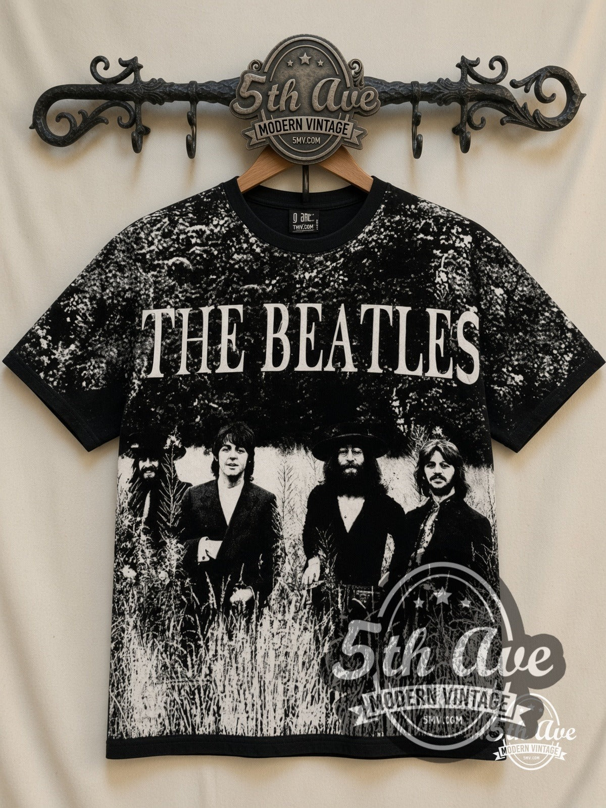 The Beatles Field Photo all-over-print vintage band t-shirt in black, front view on a display rack