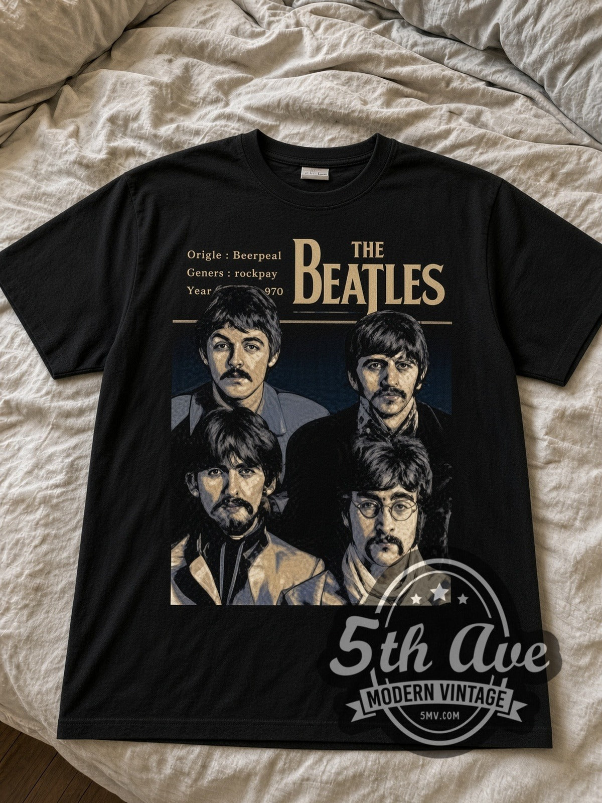 The Beatles Four Portraits black graphic tee laid flat on linen bed