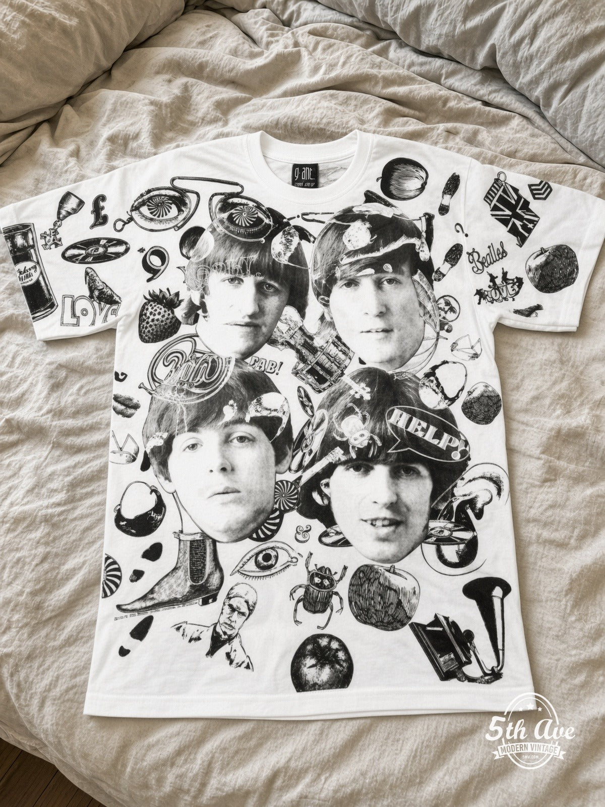 The Beatles Help Collage White all over print vintage tee laid on bed