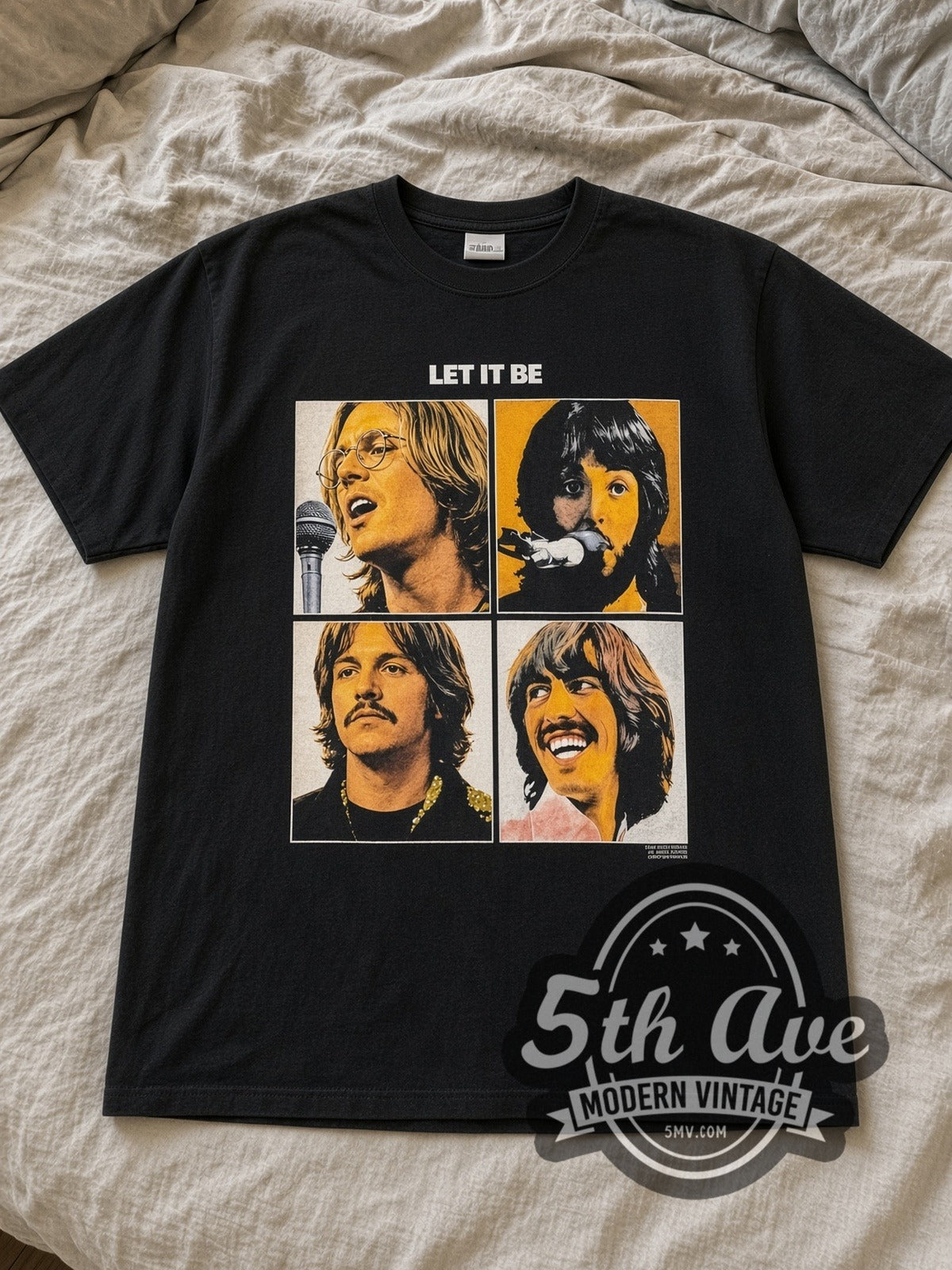 Black The Beatles Let It Be 1970 Vintage Band T-Shirt laid flat on a linen bed