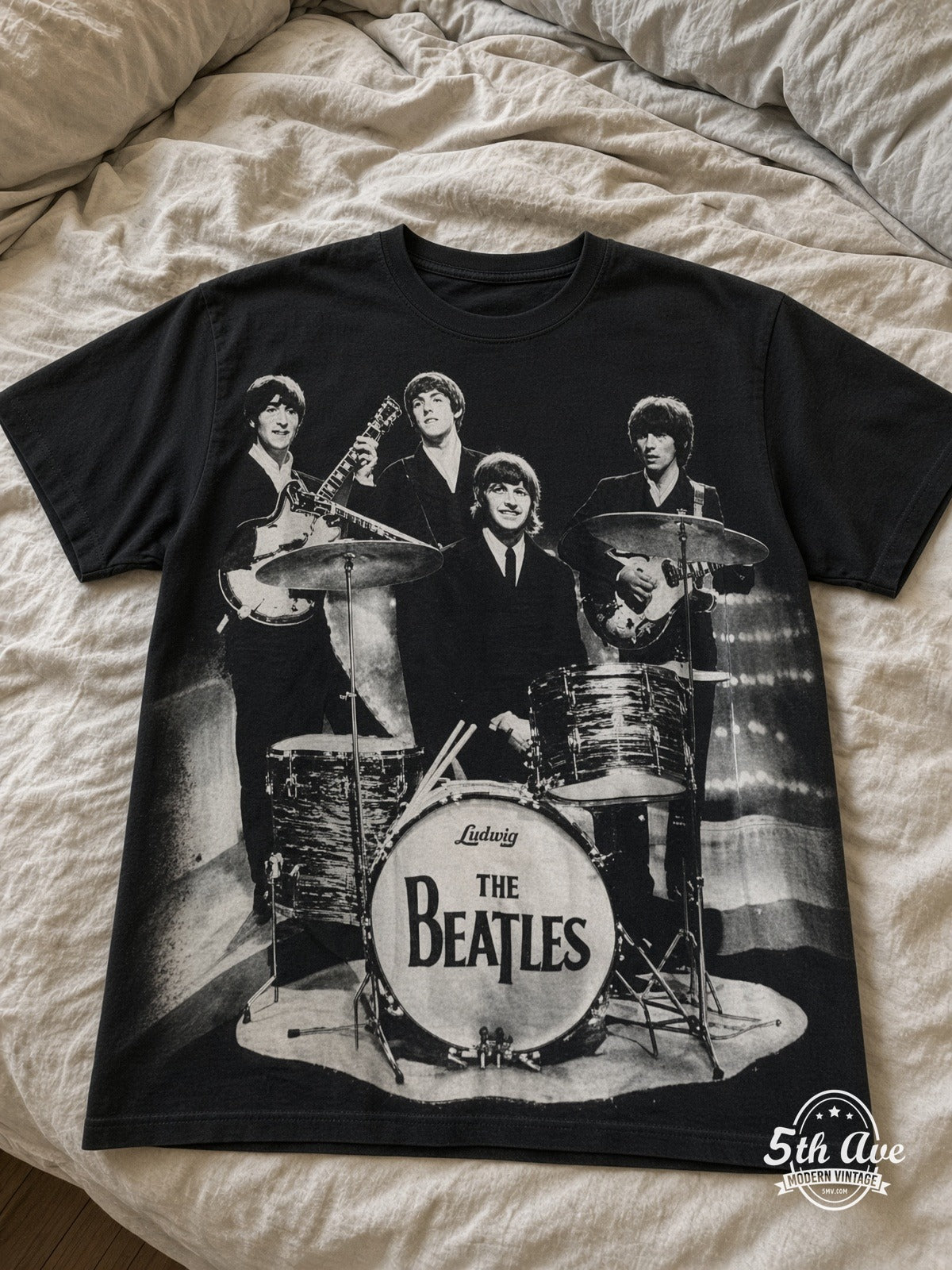 The Beatles Live Abbey Drums all over print vintage tee laid on bed