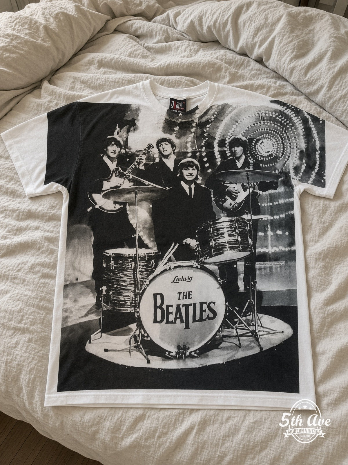 The Beatles Montage Drums all over print vintage tee laid on bed