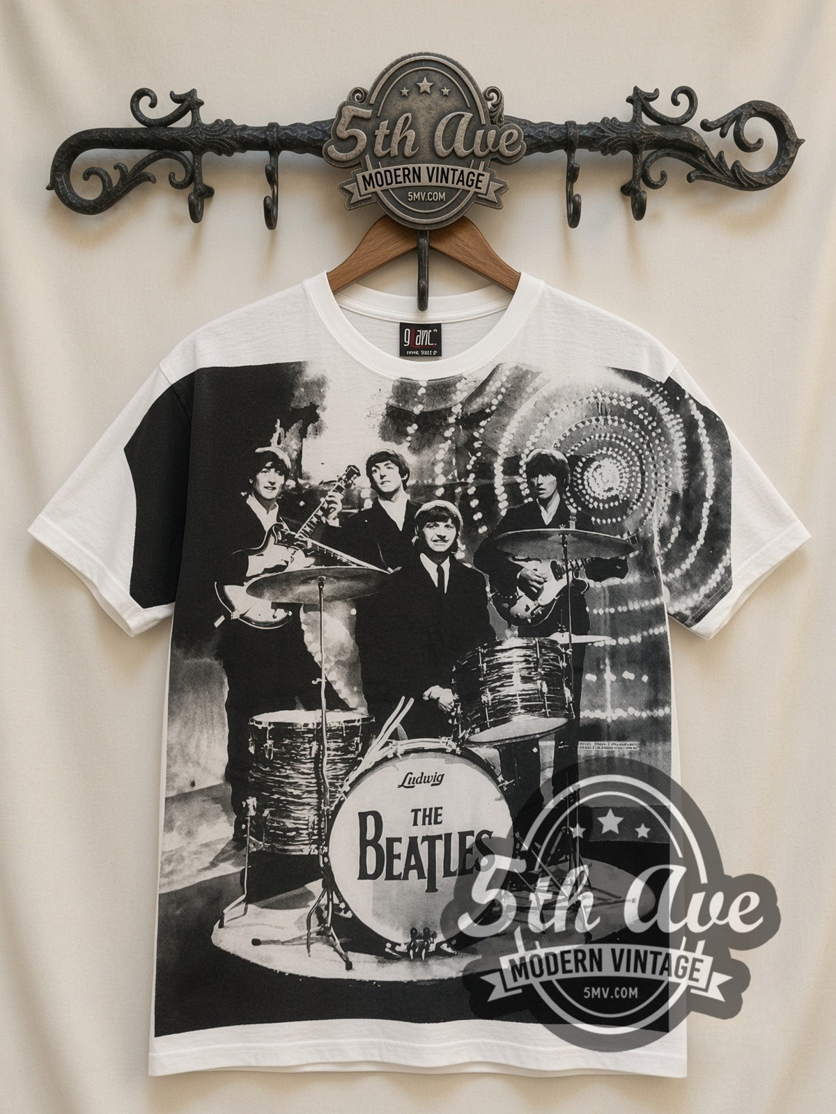 The Beatles Montage Drums all-over-print vintage band t-shirt in white, front view on a display rack