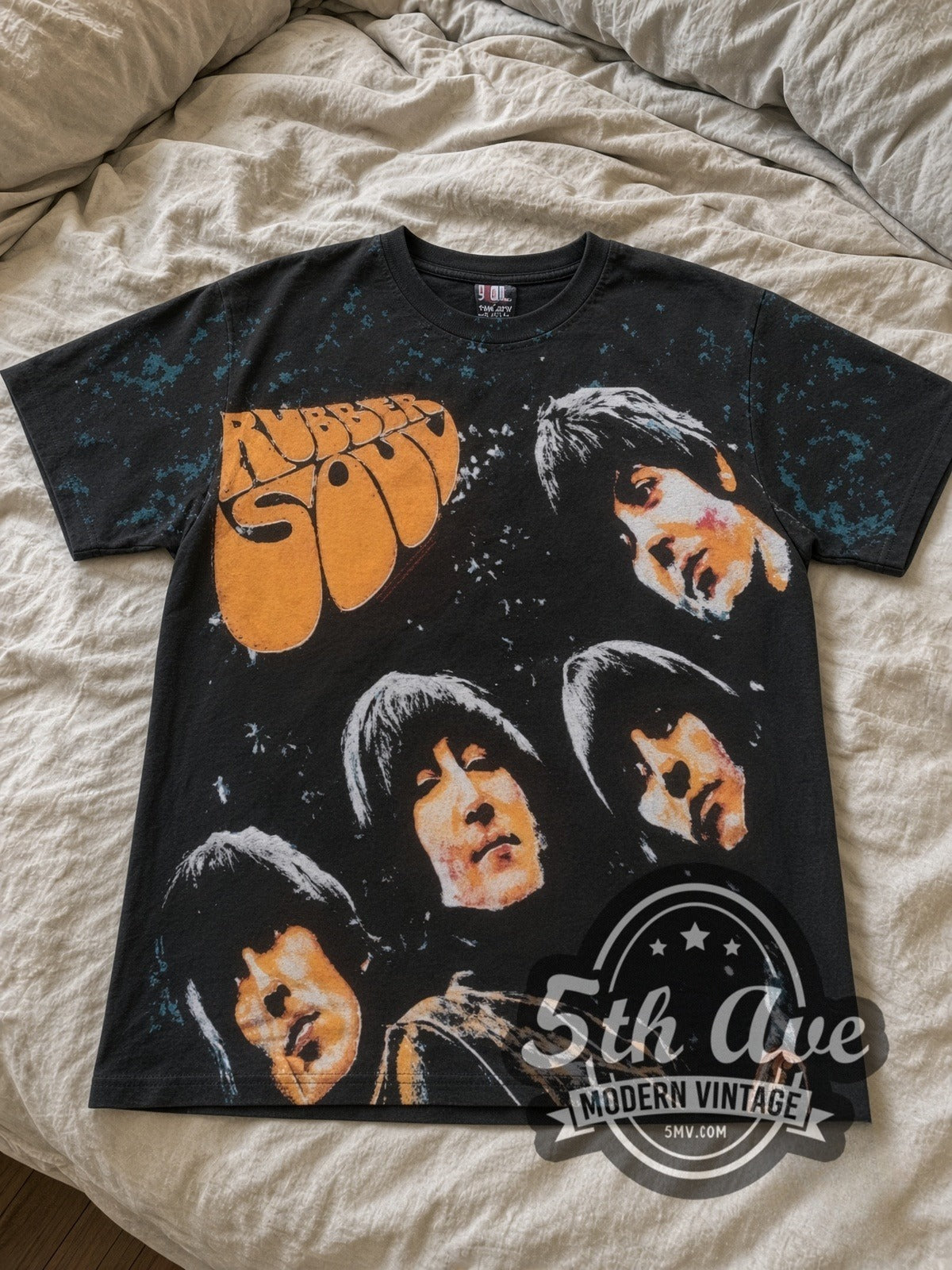The Beatles Rubber Soul Black all-over-print vintage band tee laid flat