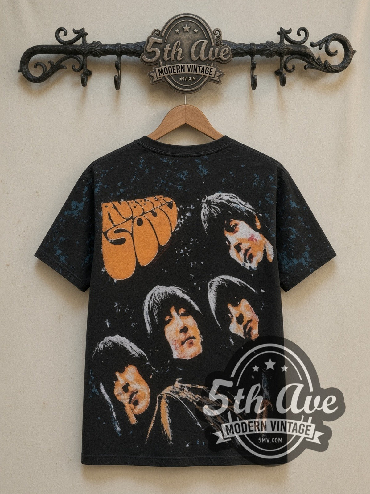 The Beatles Rubber Soul all-over-print vintage band t-shirt in black, back view on a display rack