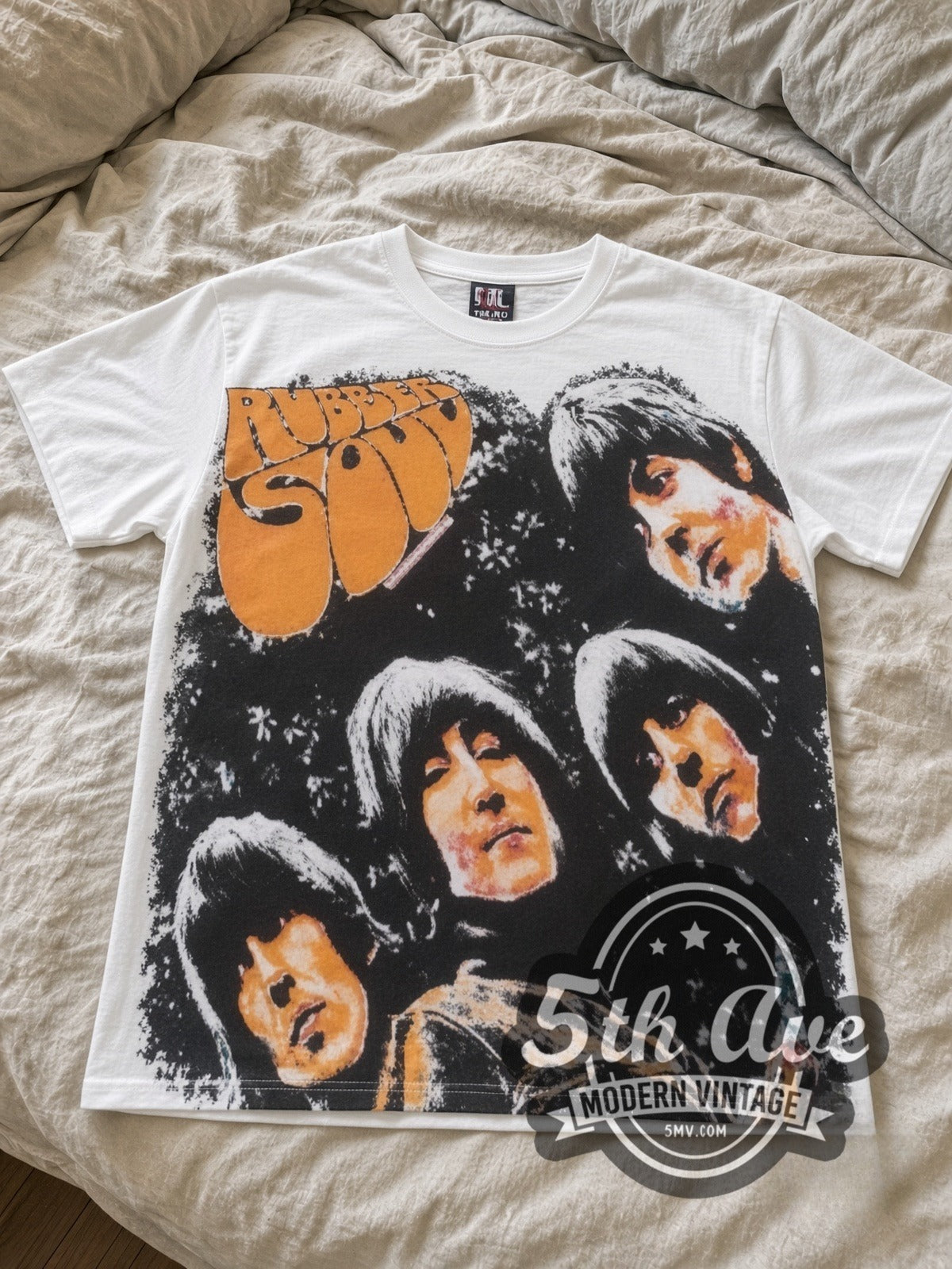 The Beatles Rubber Soul all-over-print vintage band tee laid flat