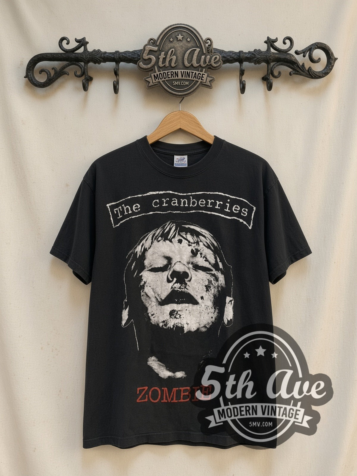 The Cranberries Zombie / No Need to Argue vintage band t-shirt, front view on a display rack