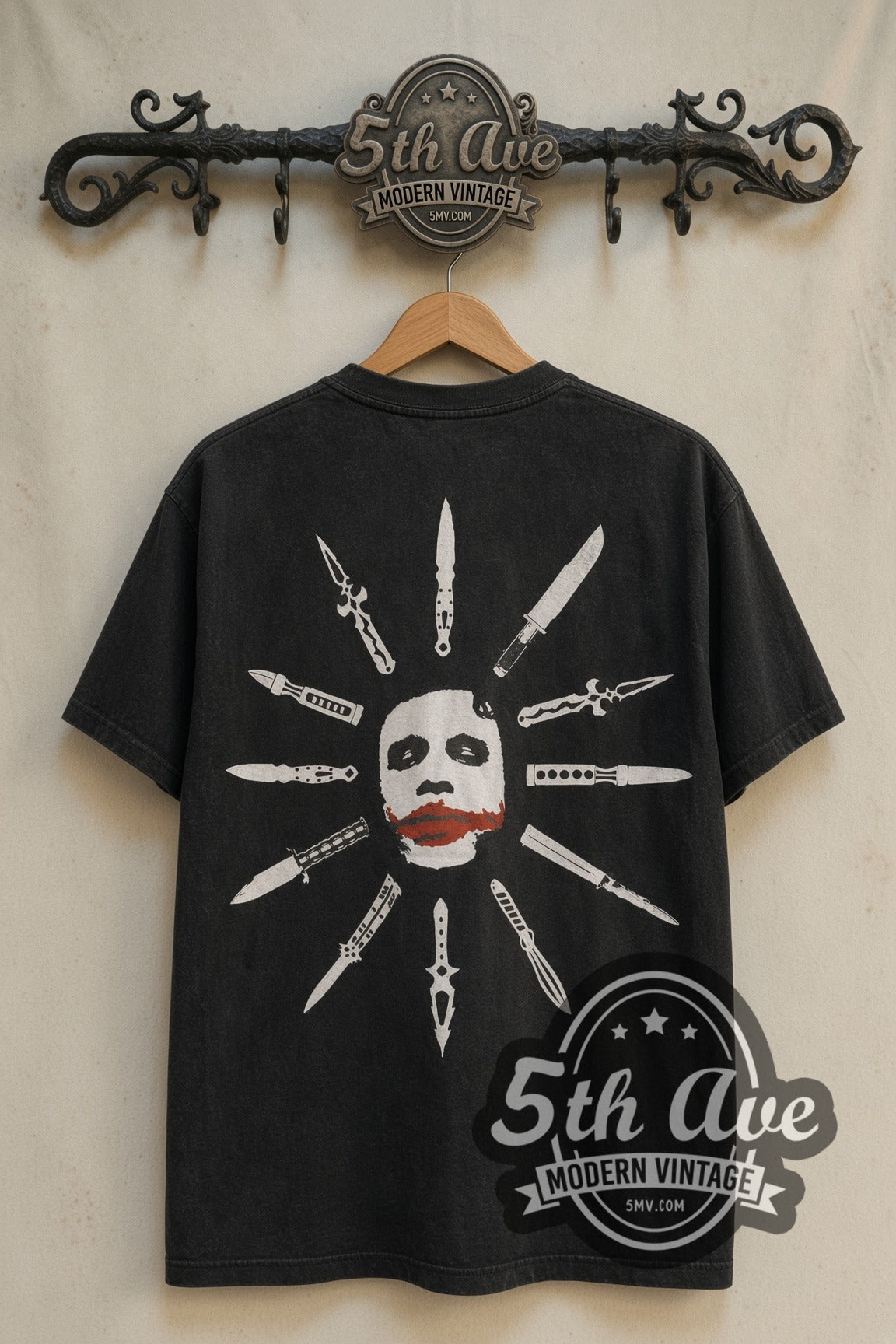 Joker face ringed by knives on Dark Knight movie tee back on rack