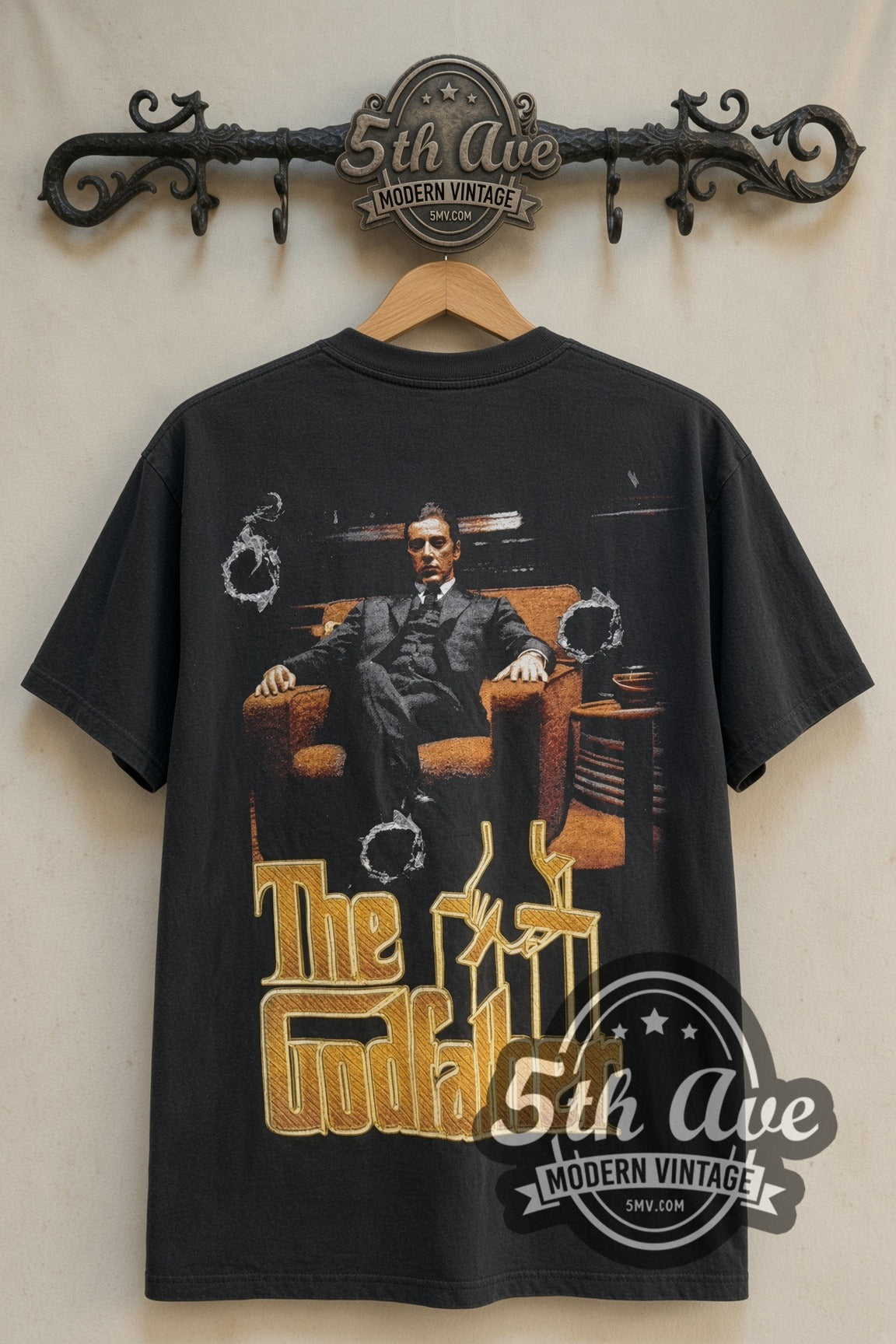 Michael Corleone in chair with Godfather logo on vintage movie tee back on rack