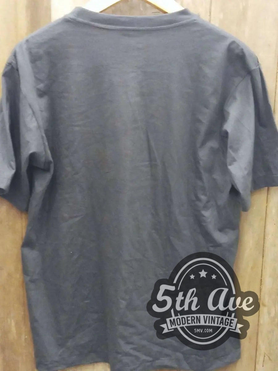 The Kinks vintage band t-shirt hanging on a hanger